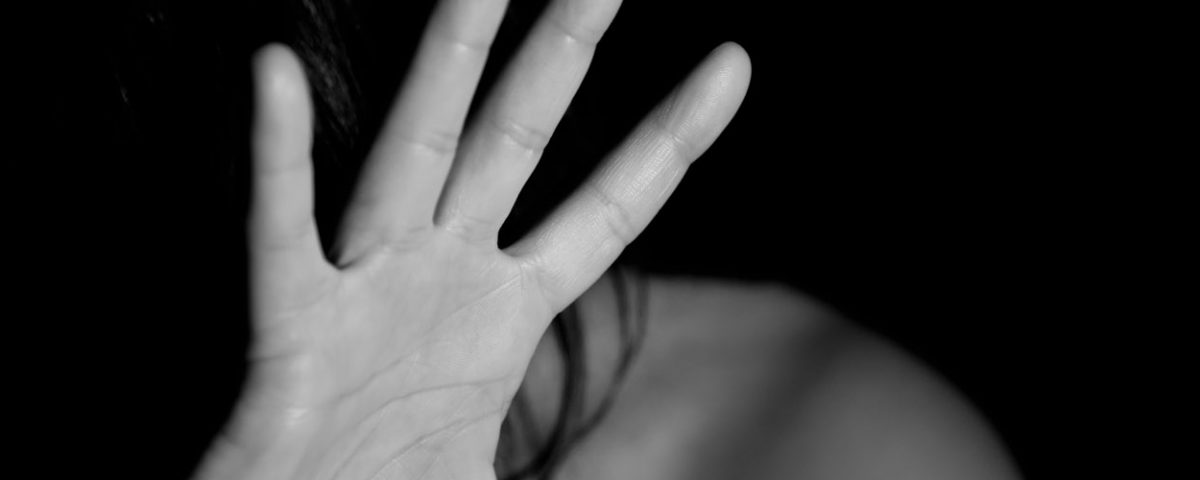 Woman's hand stopping violence